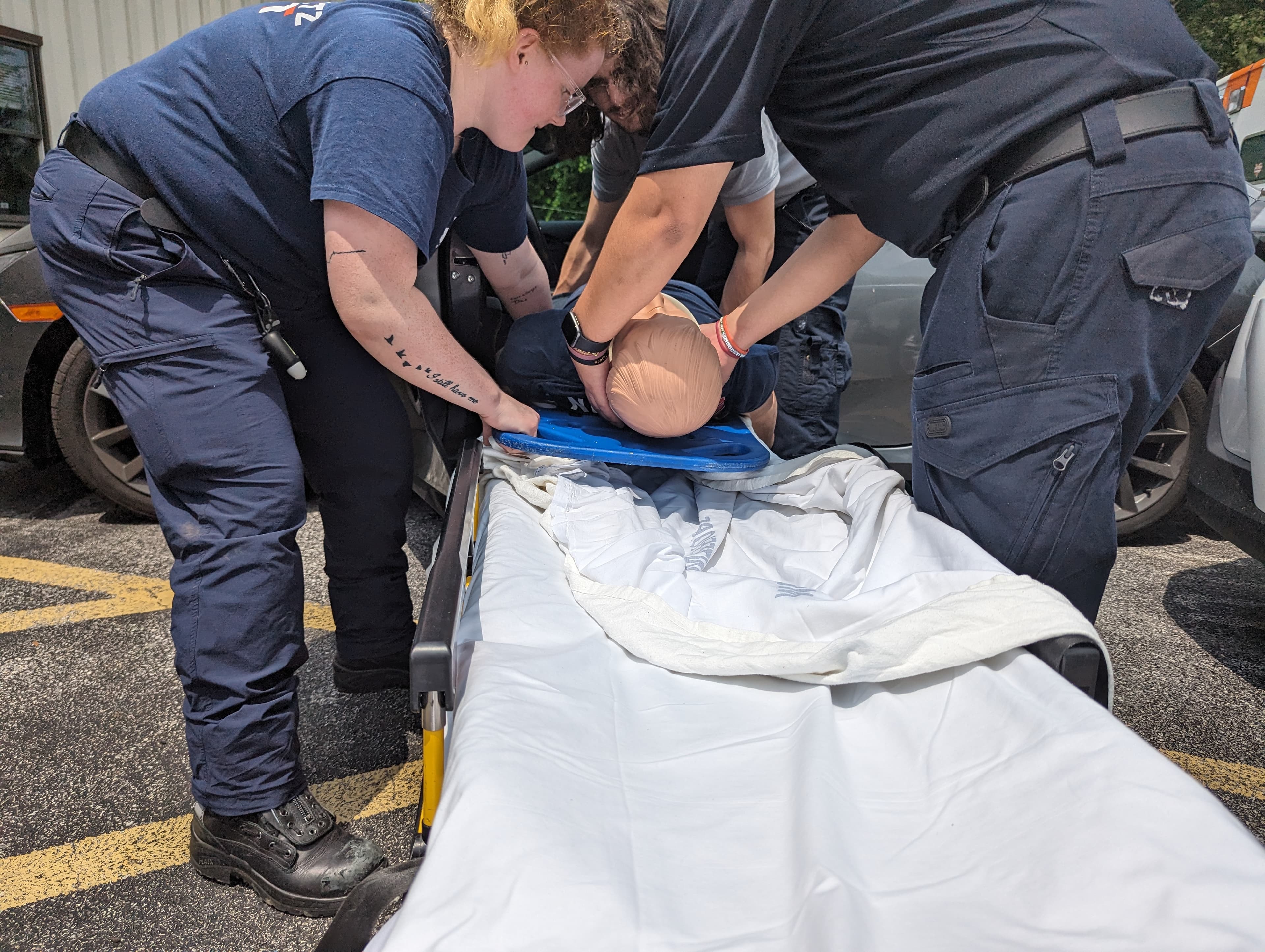 NPRS members removing dummy from car in drill